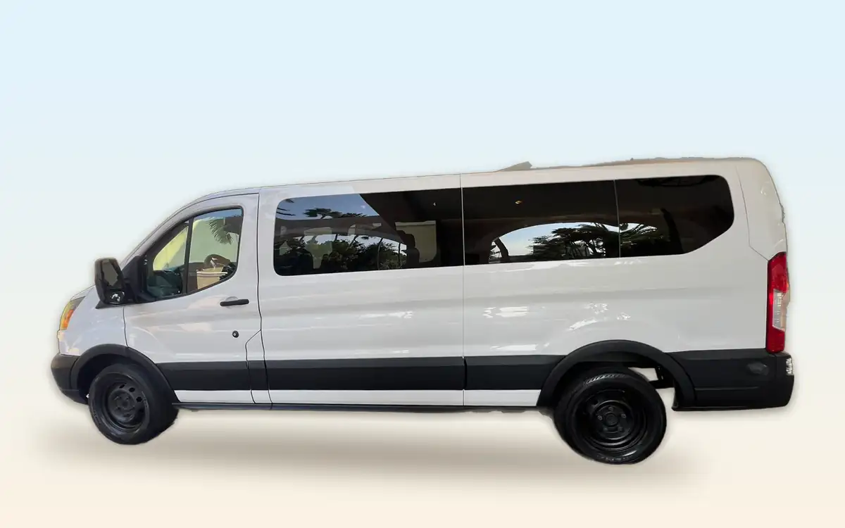 White Ford Transit passenger van from Dusk till Dawn, side view